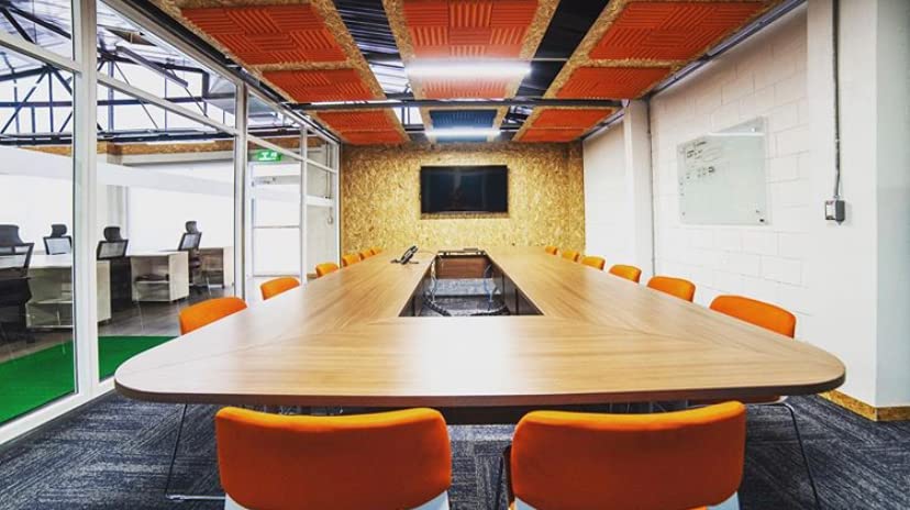Orange acoustic foam is used in office space to eliminate echo and dampen the conference room's sound! Design and installation by Locus Arquitectos SA. . SHOP NOW: soundassured.com/collections/we… . #office #offices #officedecor #interiordesign #officesoundreduction #acousticsolutions