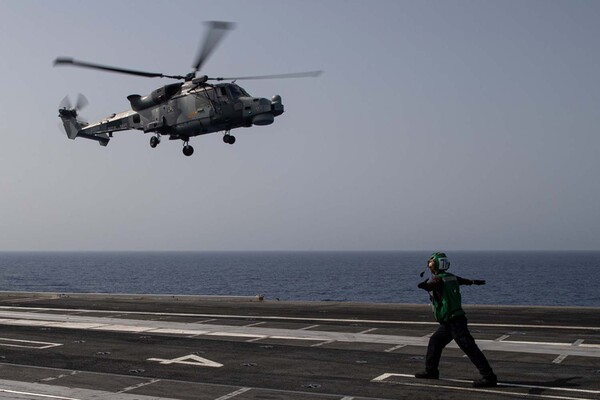 Royal Navy helicopter becomes first British aircraft to land on world’s largest warship rfr.bz/t6ixitm Order helicopter paint from the aviation paint pros at Casher's Aviation Finishes <a href="/cashersaviation/">Casher's Aviation Finishes</a> #ehelipad #royalnavy #britishaircraft #helicopterpaint #aviationpaint