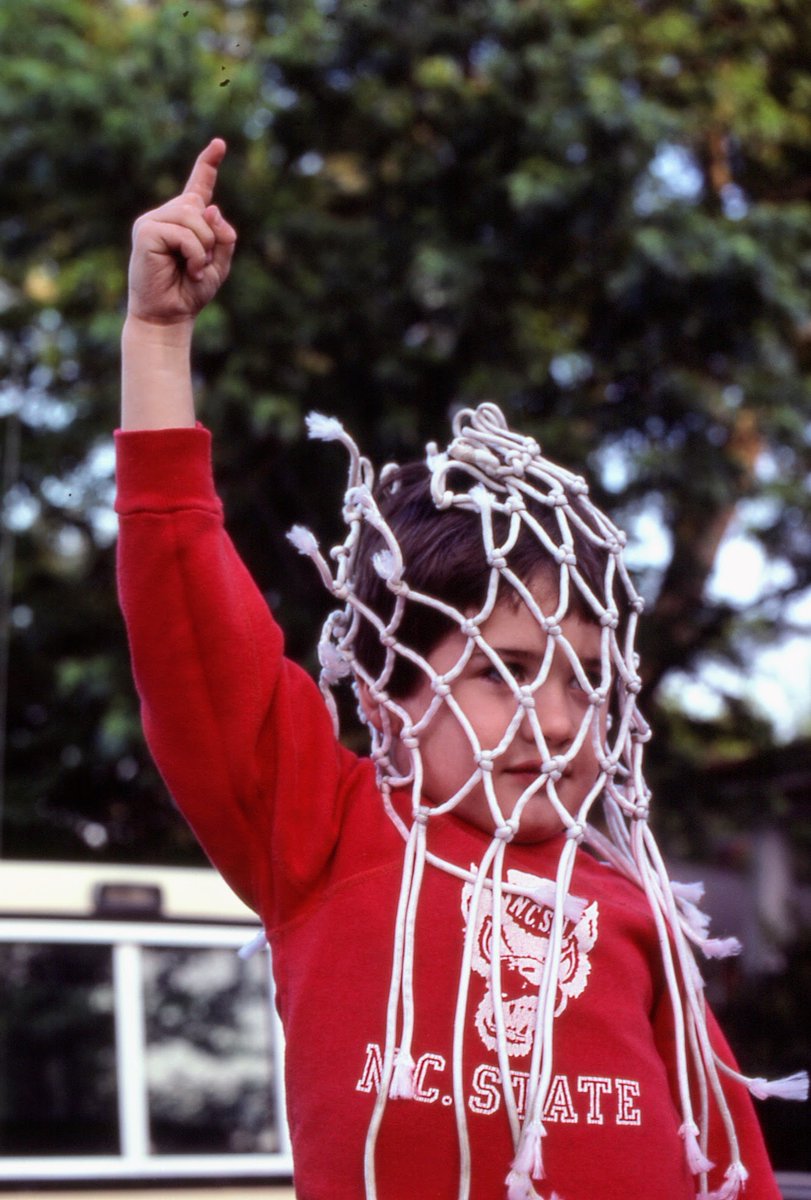 BrickEngraver's tweet photo. @PackPride Forty years ago was the game that reinvented college basketball.  My friend Pat Jones got the nets to frame for his office and I had to grab a few pics with them draped over him. He is now 44 and works for NCSU. https://t.co/Zj7P6R3Vsr