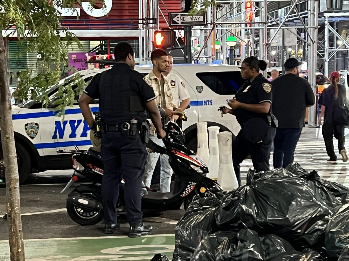 The NYPD getting another scooter off the street.