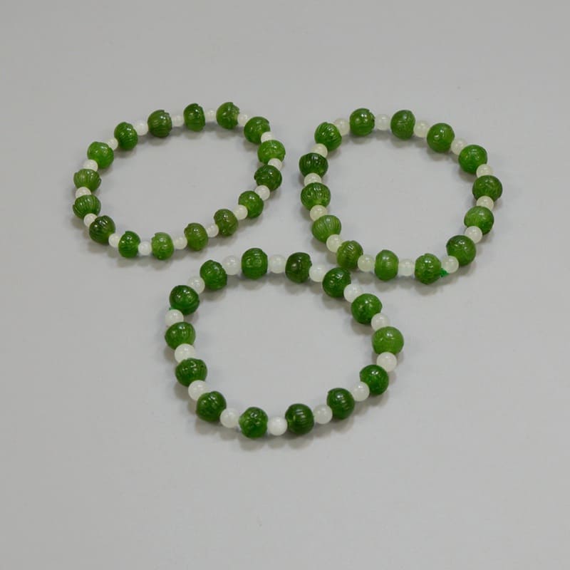 Jade stretch bracelets are wonderful beaded jewelry gifts for girls or women. They are healing energies worn as beaded bracelets. Small round beads are green nephrite jade, and sixteens are natural white stones. Each gemstone is carved by hand.
#beadedjewelry #beadedbracelets