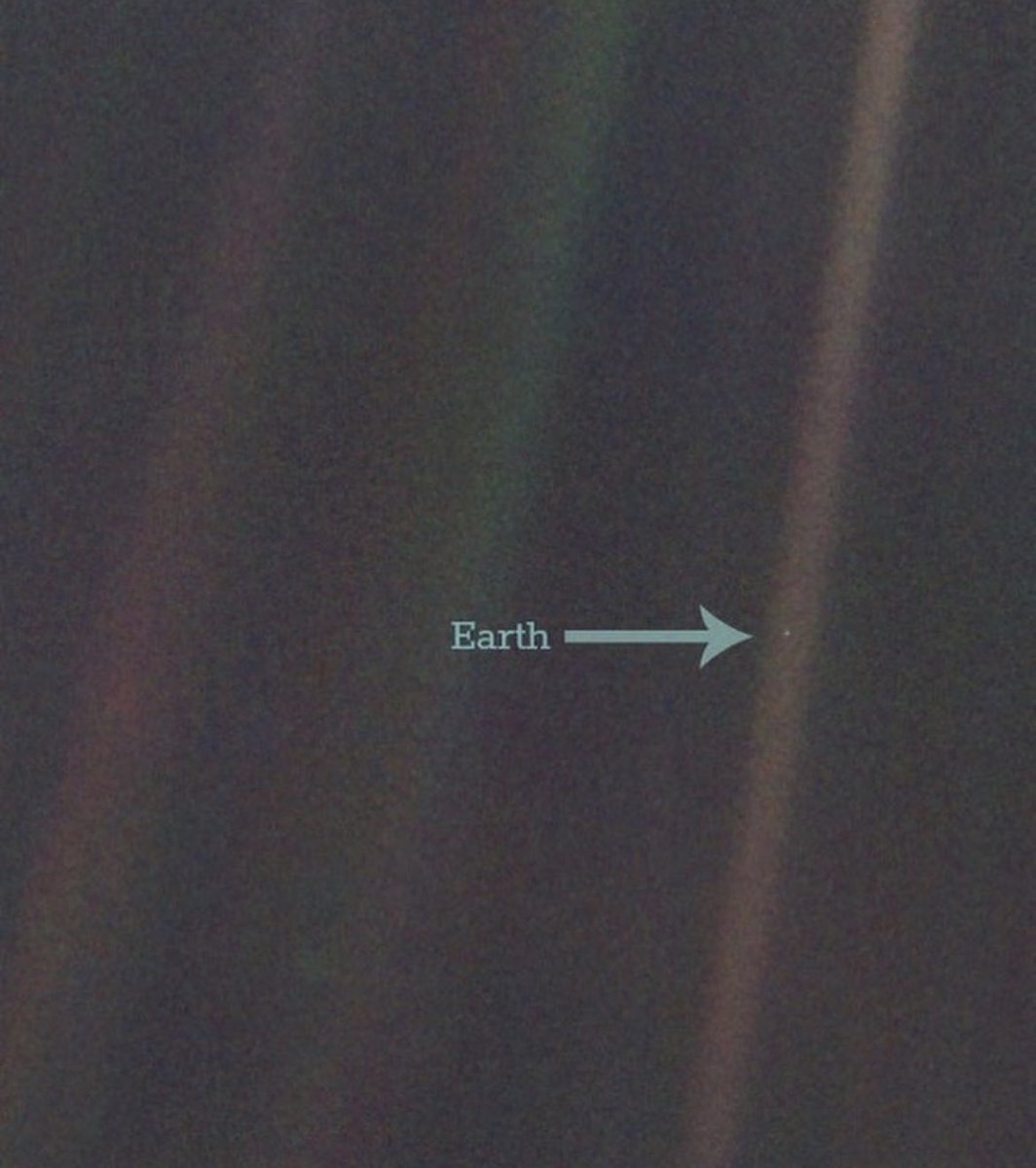 The Pale Blue Dot is an iconic photograph of Earth captured by the Voyager 1 space probe in 1990. Taken from a distance of around 6 billion kilometers (3.7 billion miles) as Voyager 1 was departing our solar system, the image portrays Earth as a tiny, pale blue speck in the