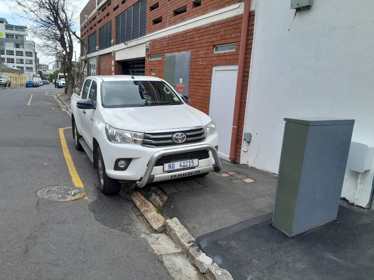 robket's tweet photo. @geordinhl Speaking of law and order, can we get this bakkie that's parked on the pavement blocking pedestrian movement impounded (or towed away, or just ticketed perhaps?) Rules are rules, and they apply to everyone, right? https://t.co/O1gbgTaePE