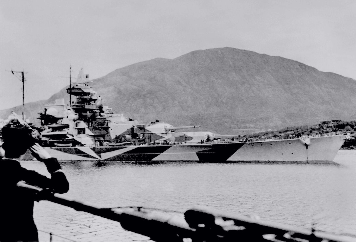 Date: September 06, 1943. Location: Altafjord, Norway. Event: Following a 5-month long hiatus in activities, German battleship Tirpitz is departing her anchorage in Kåfjorden to retake the Island of Spitzbergen from the Allies (Operation Sizilien).