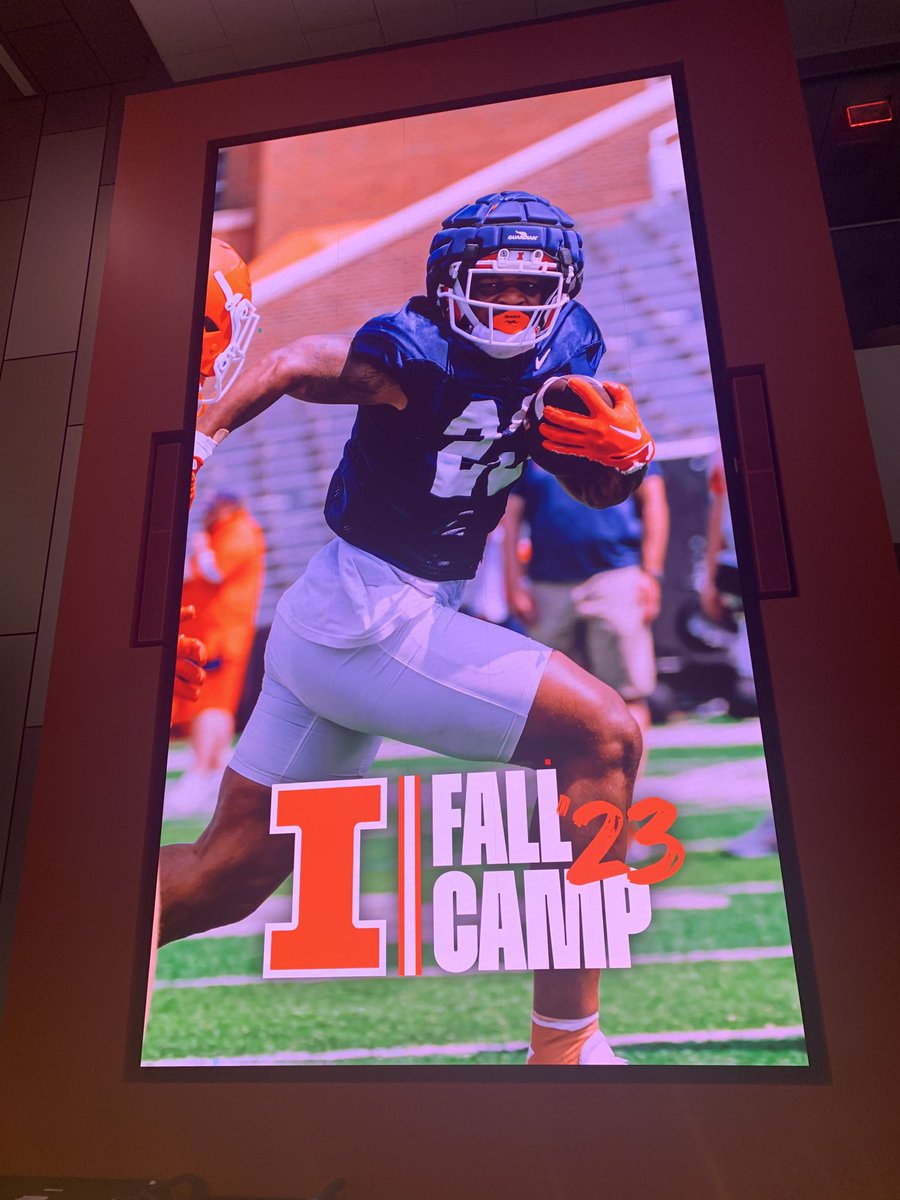 BretBielema's tweet photo. Walking in everyday we have a featured player on the big screen. One guy at a time but fun to see these guys #keepstackindays 

#famILLy #ILL #FallCamp https://t.co/wmPtvsLpp4