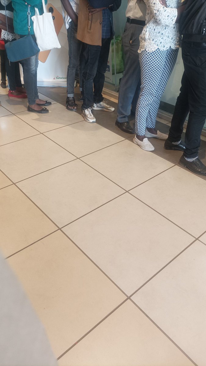 Monadanniels's tweet photo. @SafaricomPLC trm mall you need to do something... cueing like for 2hrs just for customer care service... https://t.co/TbmhEo7FkX
