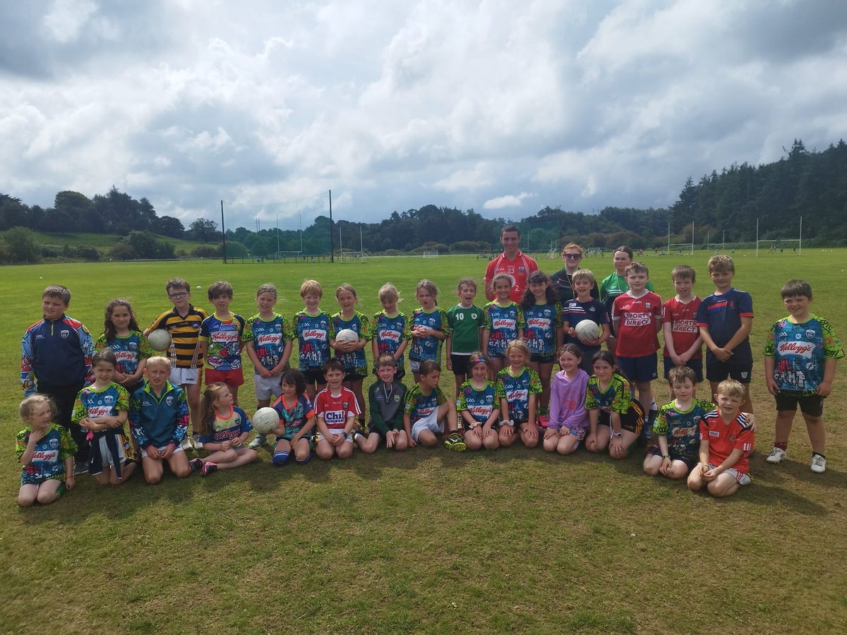 canoveegaa's tweet photo. Cúl Camp groups and their coaches at our camp in Carrigadrohid this week. 125 children having fun, developing their football skills. Well done to all of the coaches for their efforts this week 🖤🧡 https://t.co/ndr9kIpA9F