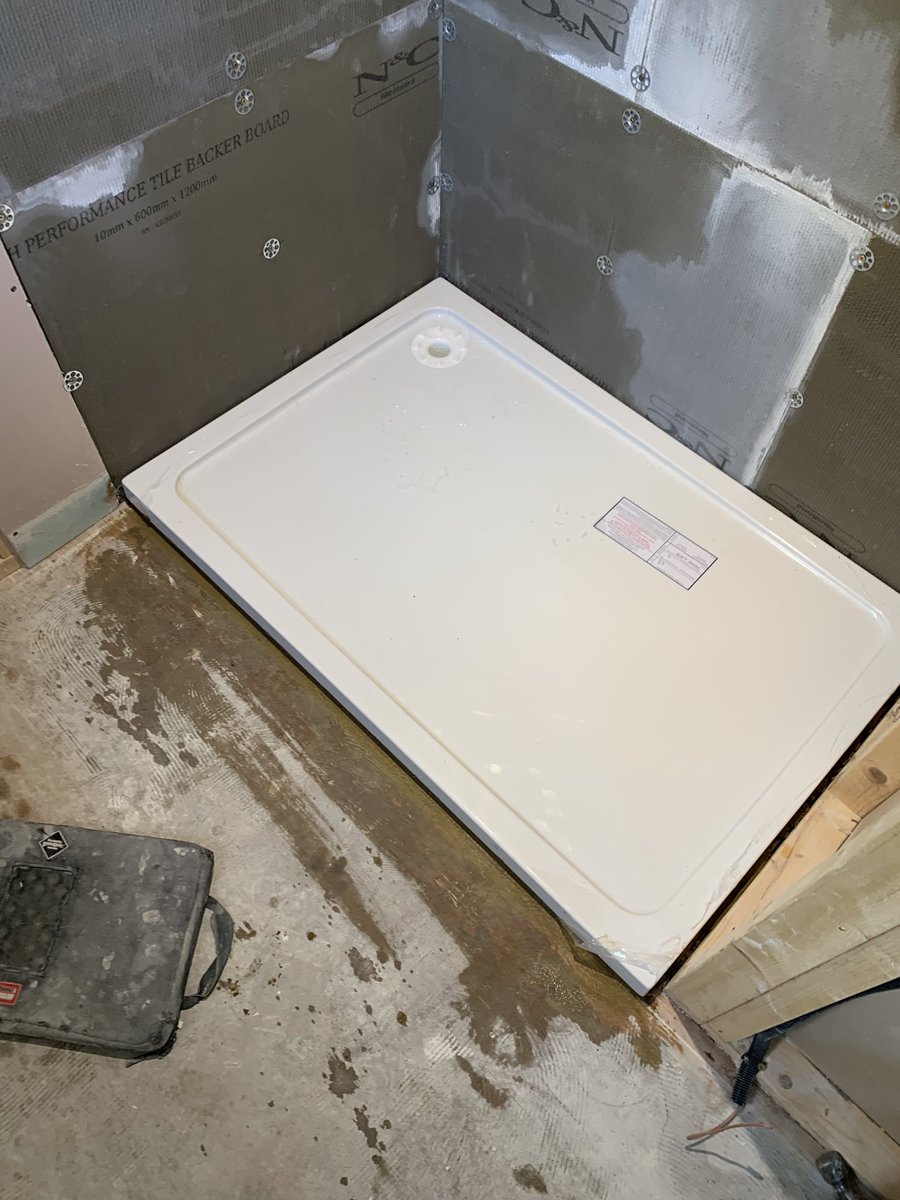 Shower tray install today …. 1200 x 800 bedded on sand & cement, 12mm ply sitting on 22mm chipboard, membraning the shower walls now #showertray #plumbing #bathroominstall #hertfordshire