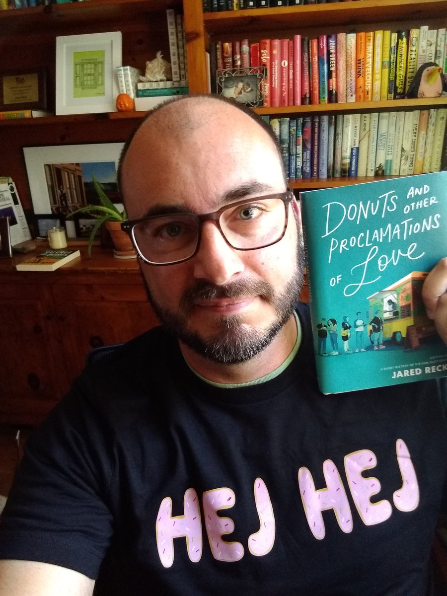 reckj's tweet image. Librarians, man. 
Who else would buy 100+ copies of your little book to share with their teacher/librarian community, then also send you a homemade T-shirt your MC would wear on his food truck?
Superheroes, every one of them.🍩🧡

Thank you @Mrs_McHugh @LBookends + Yorkville115!