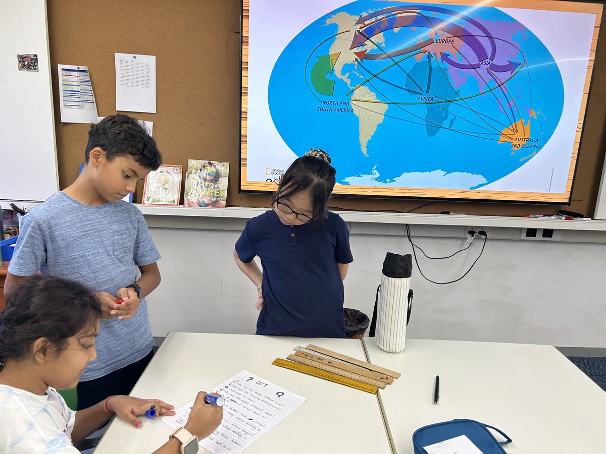 AISCElementary's tweet image. #AISCGrade5 students work together to ask questions about the map and what it is showing as a provocation for their new social studies unit. #AISCElementary