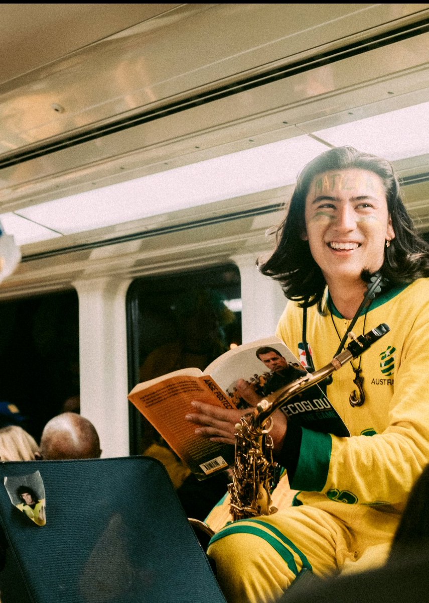 tomas__phillips's tweet photo. Don't normally do this but I'm really happy with this photo someone got of me on Wednesday night. 

Not sure if it's the Johnny Warren sticker, Ange book or the train full of people singing on their way to a World Cup semi final. 

Either way I'm very proud Australian right now https://t.co/Qp2kmk5zHX