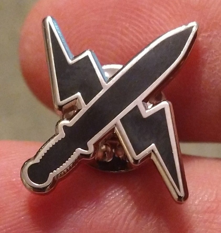 New pins!  This is the "Blade and Bolt", emblem of my character Ana from my Valkyrie Chronicles series (and soon to be reappearing in my story universe in new titles!!)