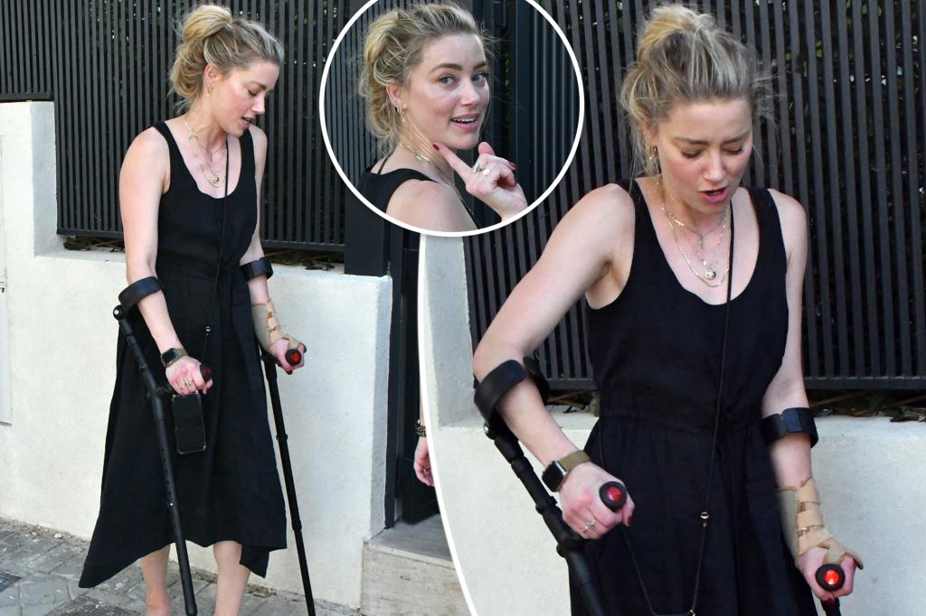 PageSix's tweet image. Amber Heard hobbles with crutches in Madrid after nasty injury from training for NYC Marathon trib.al/QmmE5MN
