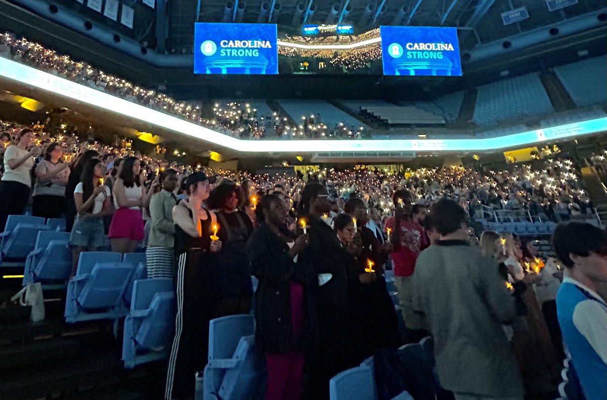 UNC's tweet photo. Tonight, the #UNC community gathered in the Dean E. Smith Center to honor the memory of Zijie Yan. As we continue to heal together, let us remember the words of student body president Chris Everett, “Professor Yan- Our Carolina Blue skies will always be a memory of you” https://t.co/YzwpBgGMwI