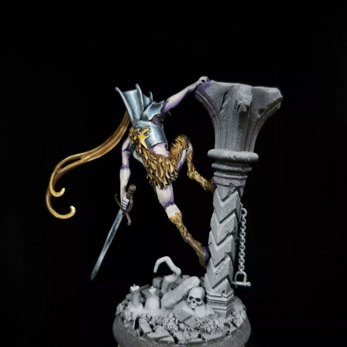 WIP of one of the three Vyrkos Blood-born vampires from Warhammer Quest: Cursed City

I started the skin off with dark purples and moved up to light purples before adding some pale skin tones. The purple is really obvious in the shadows and I'm liking the overall effect