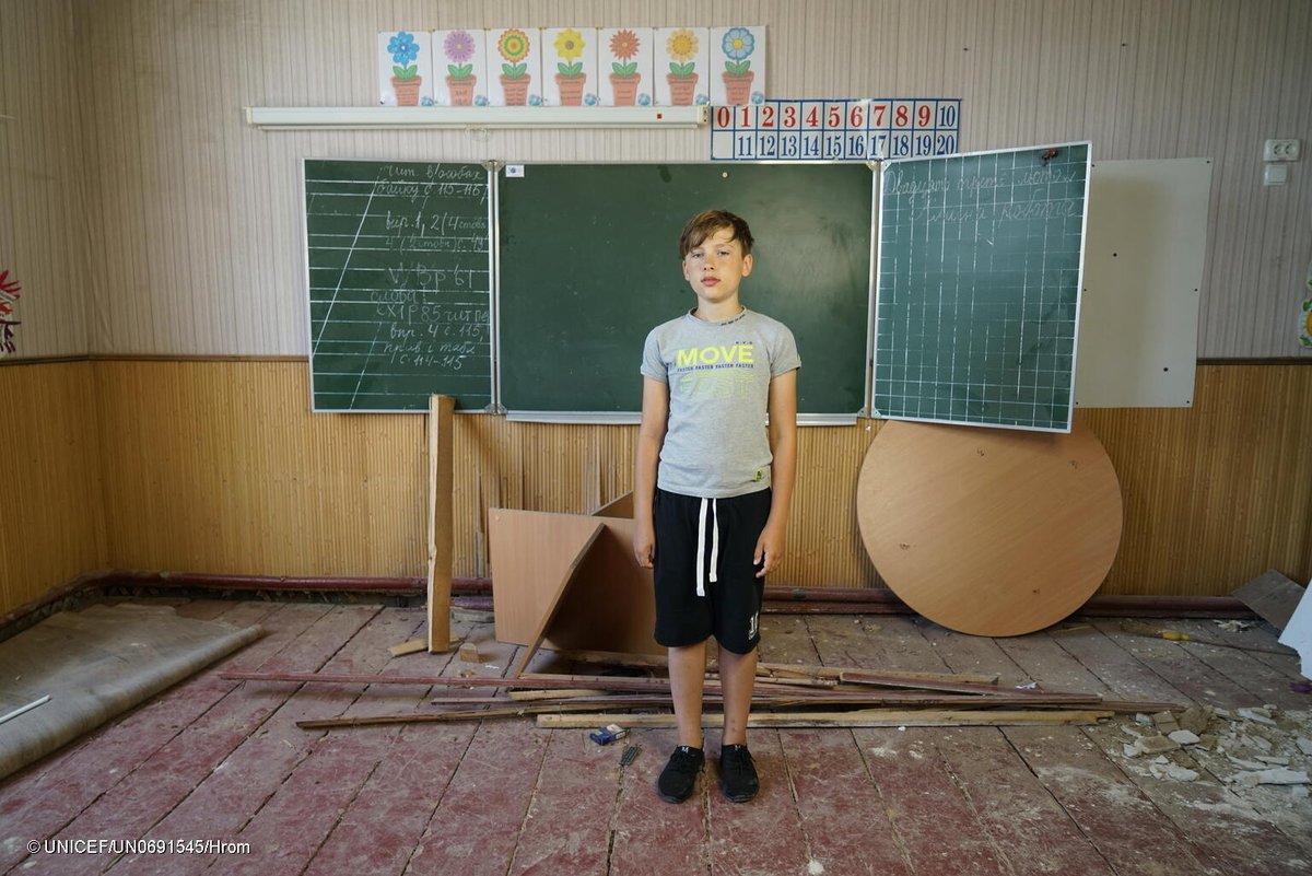 Andriy, 11, stands in a classroom that is severely damaged by shelling in Ukraine. The war and COVID-19 have led to a fourth year of disrupted education for students across the country. UNICEF is working to help get every child’s learning back on track. #LetMeLearn