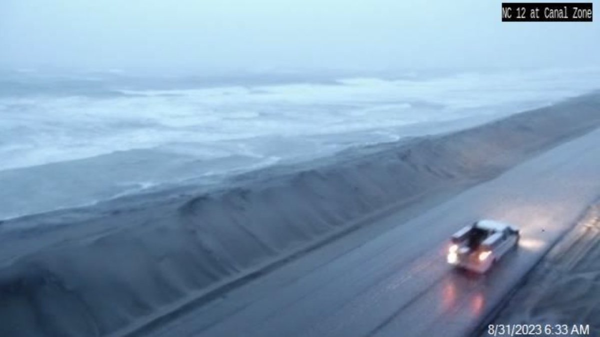 Yes, NC 12 is open and passable. BUT this is NOT a day to be out on the roads. Standing rainwater, blowing sand and strong winds can be expected anywhere you go today. High tide is coming up in another 90 minutes or so. If you must drive today, do it with EXTREME CAUTION.
