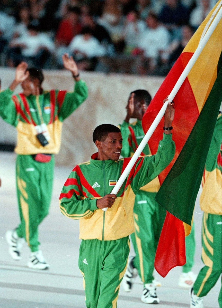 The Ethiopian world-class long-distance athlete Haile Gebreselassie carries his country's flag as the Ethiopian team marches into the Panathinaikon Stadium in Athens on the 6th World Championships,  August 1, 1997