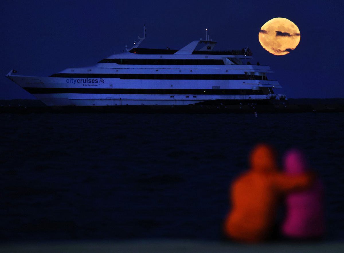 A blue supermoon rises over Lake Michigan in Chicago on Wednesday, Aug. 30, 2023.