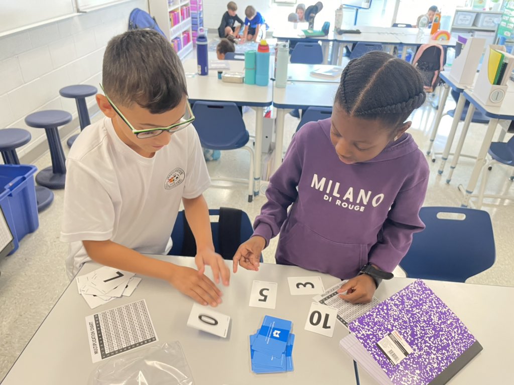 barrcaveclass's tweet photo. Warming up those multiplication fact fluency muscles with a few rounds of Multiplication War!!! #mathfactfluency #multiplication #johnsonpride https://t.co/c69Q5UGHeJ