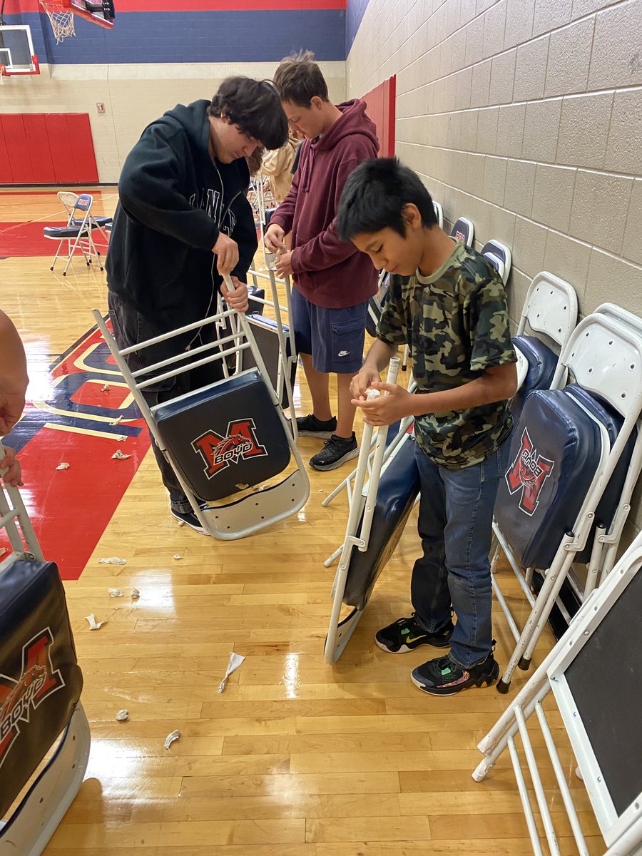 BoydWrestling's tweet photo. Our Bronco Wrestlers knocked out some character reps this morning as they reclaimed 56 chairs by replacing the protective caps on the legs so we will have more than enough seating for our wrestling, sub-varsity Volleyball, and basketball teams! #characterreps @MISDathletics https://t.co/1XSRBvWxoy