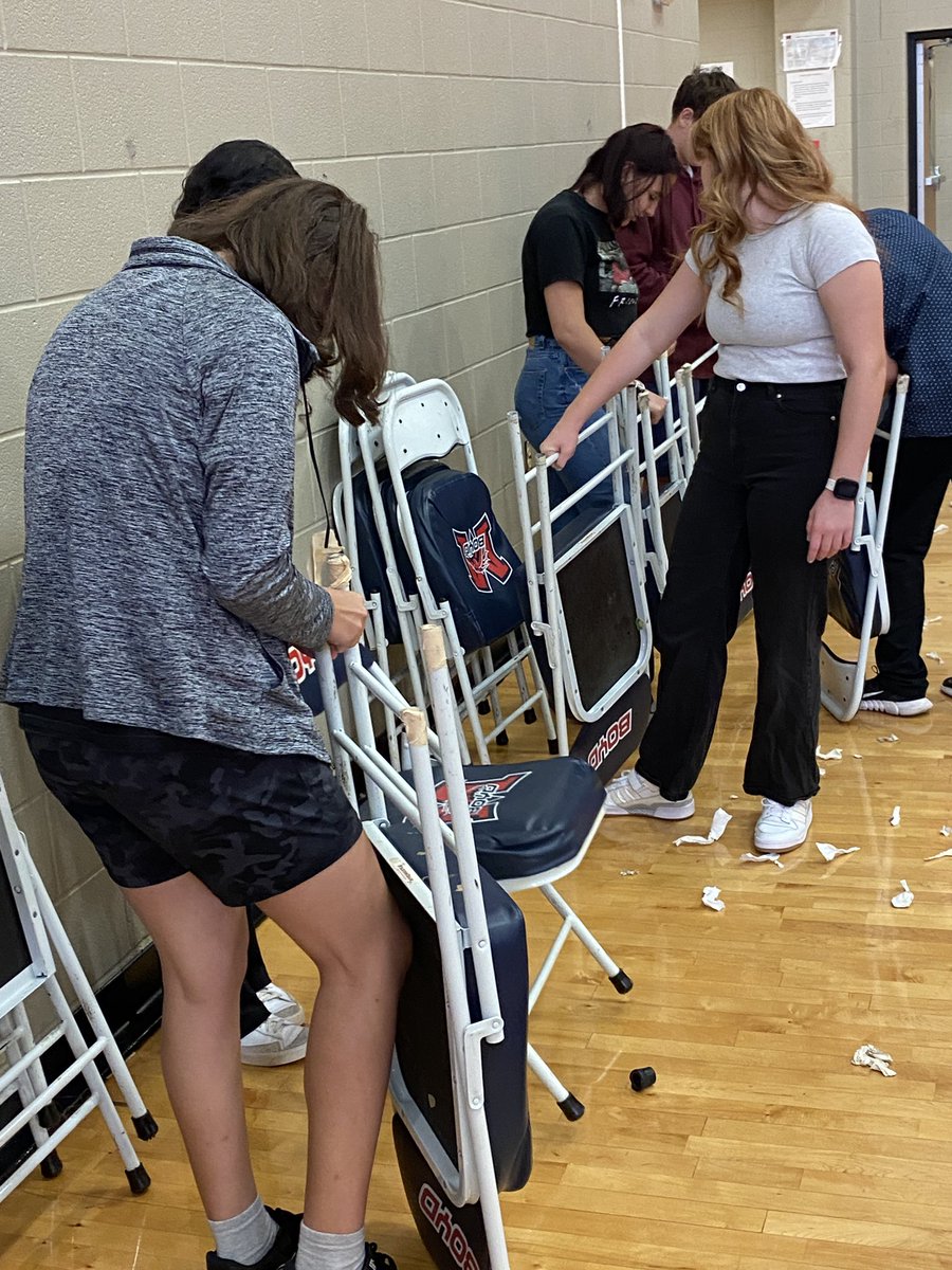 BoydWrestling's tweet photo. Our Bronco Wrestlers knocked out some character reps this morning as they reclaimed 56 chairs by replacing the protective caps on the legs so we will have more than enough seating for our wrestling, sub-varsity Volleyball, and basketball teams! #characterreps @MISDathletics https://t.co/1XSRBvWxoy