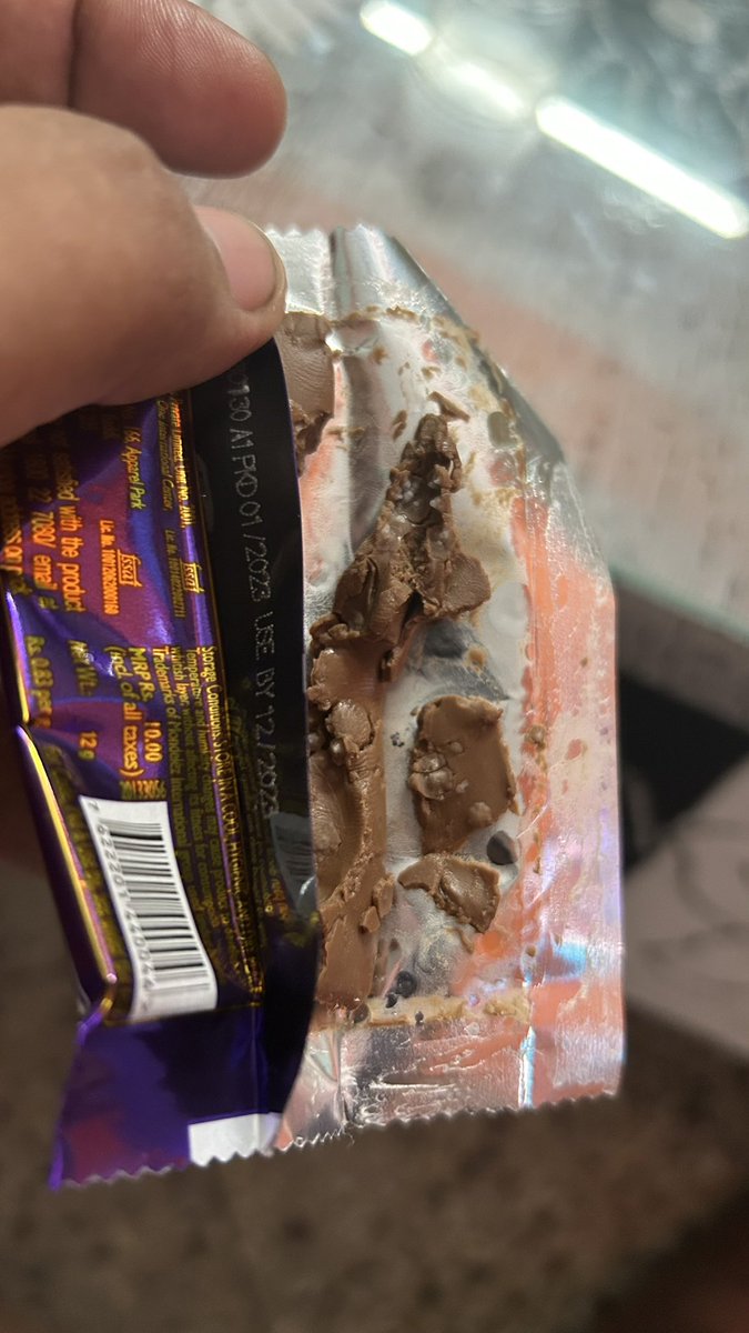 Mrinal_K_Roy's tweet photo. Got this chocolate from one of the celebrations pack and the expiry date is Dec 2023 but see the inside of the bar. White fungus is shown in the chocolate. @DairyMilkIn - What the hell are you guys providing us. @fssaiindia - Please see to it so that no mishap happens to anyone. https://t.co/qhwnCLQXAb