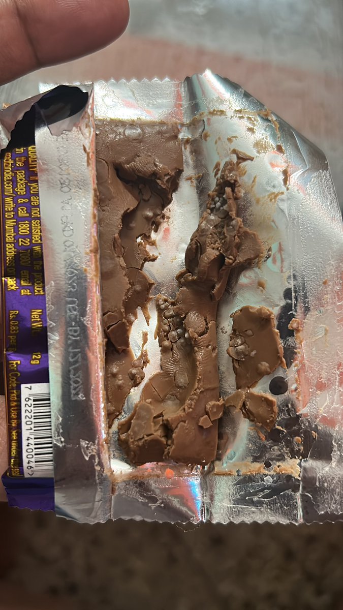 Mrinal_K_Roy's tweet photo. Got this chocolate from one of the celebrations pack and the expiry date is Dec 2023 but see the inside of the bar. White fungus is shown in the chocolate. @DairyMilkIn - What the hell are you guys providing us. @fssaiindia - Please see to it so that no mishap happens to anyone. https://t.co/qhwnCLQXAb