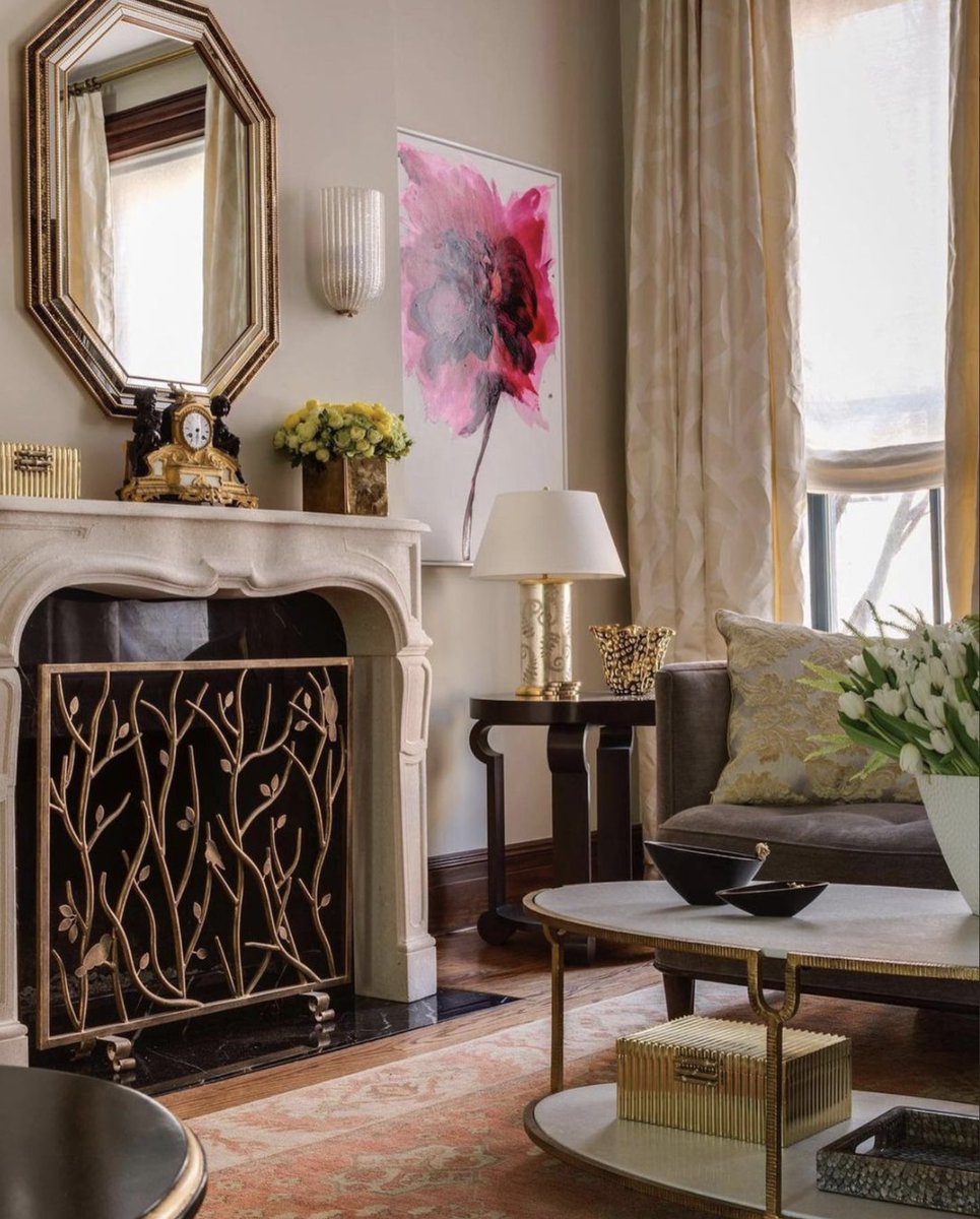 The gracious lines and tailored paneling of the Sorbonne mantel fit in harmoniously with the Art Deco stylings of this living room by @lisafrantzinteriors.

#stonemantels #stonefireplace #mantels #manteldesign #mantle #mantledesign #antiquefireplaces #bespokefireplace