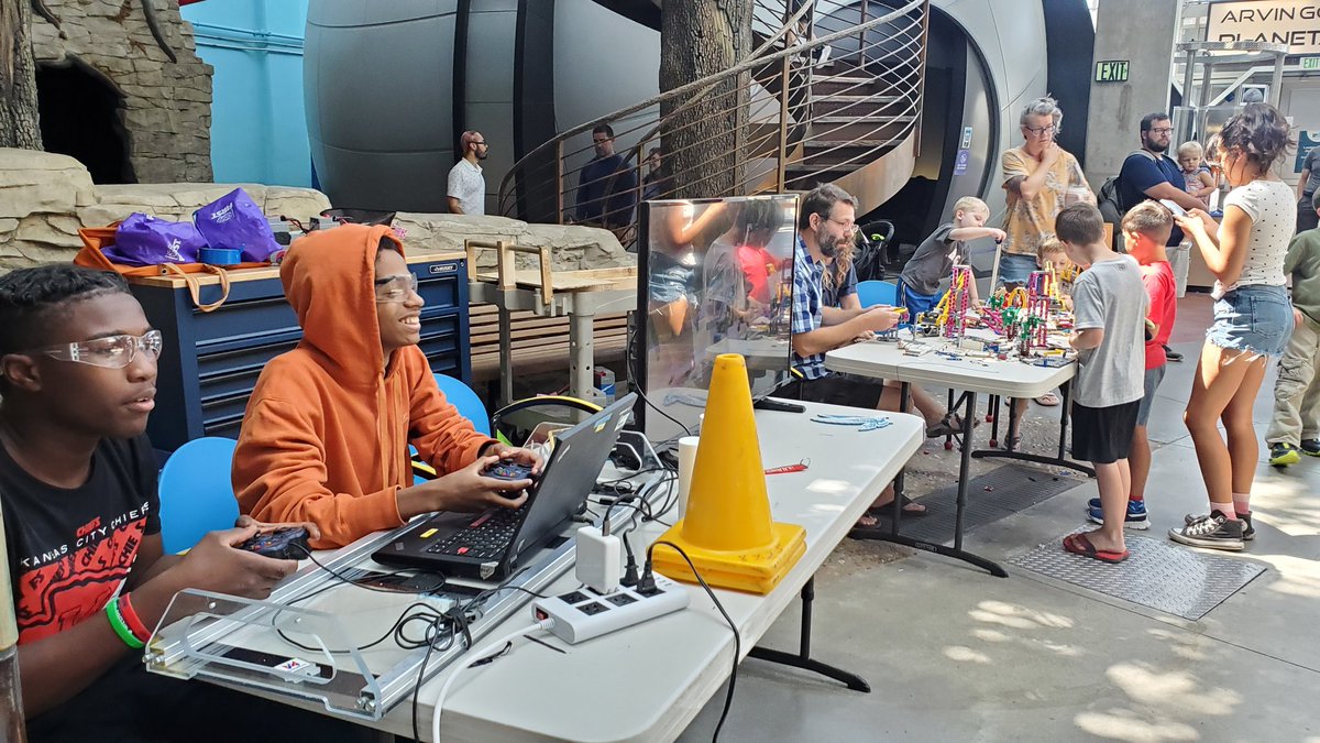 LisaG2530's tweet photo. Coaches, mentors, current team members and alumni of @CentralHS_KCPS @FIRSTKCRobotics competition team #8825 visited @ScienceCityKC this summer to talk to families and get kids excited about robotics! #wearekcps #OneCentral @kcpublicschools https://t.co/And3CYgZ4B