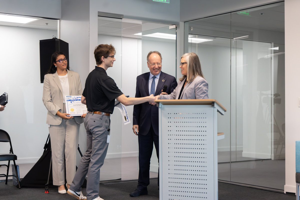 PhoenixUnion's tweet photo. Yesterday, the Kudelski Group and Arizona Governor Katie Hobbs  presented Phoenix Coding Academy alumni Noemi Caballero &amp; Parker Horejs with diplomas, honoring them as the first graduates of the Kudelski Cybersecurity Apprenticeship Program 🎓. Congratulations, Noemi &amp; Parker! 🎉 https://t.co/lrGi54Bovt