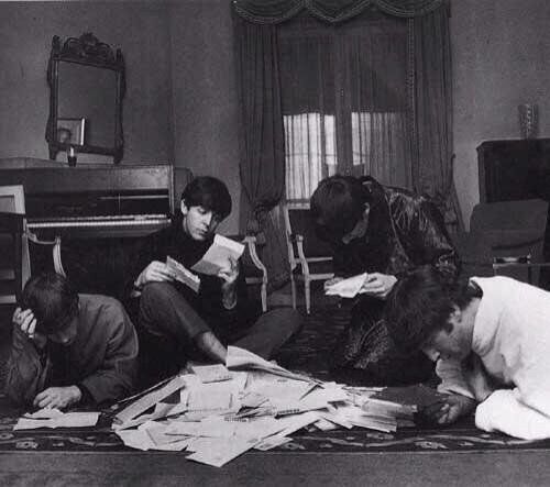 The Beatles reading and answering letters from fans, 1964.