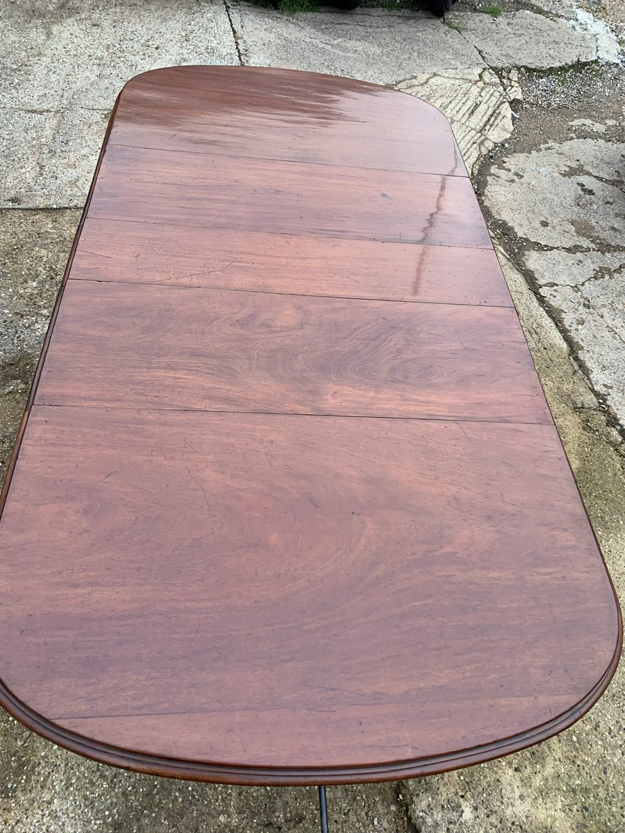Victorian mahogany dining table with 3 original leaves restored, replacing missing moulding  during restoration. Table was cleaned and colour revived before being French polished