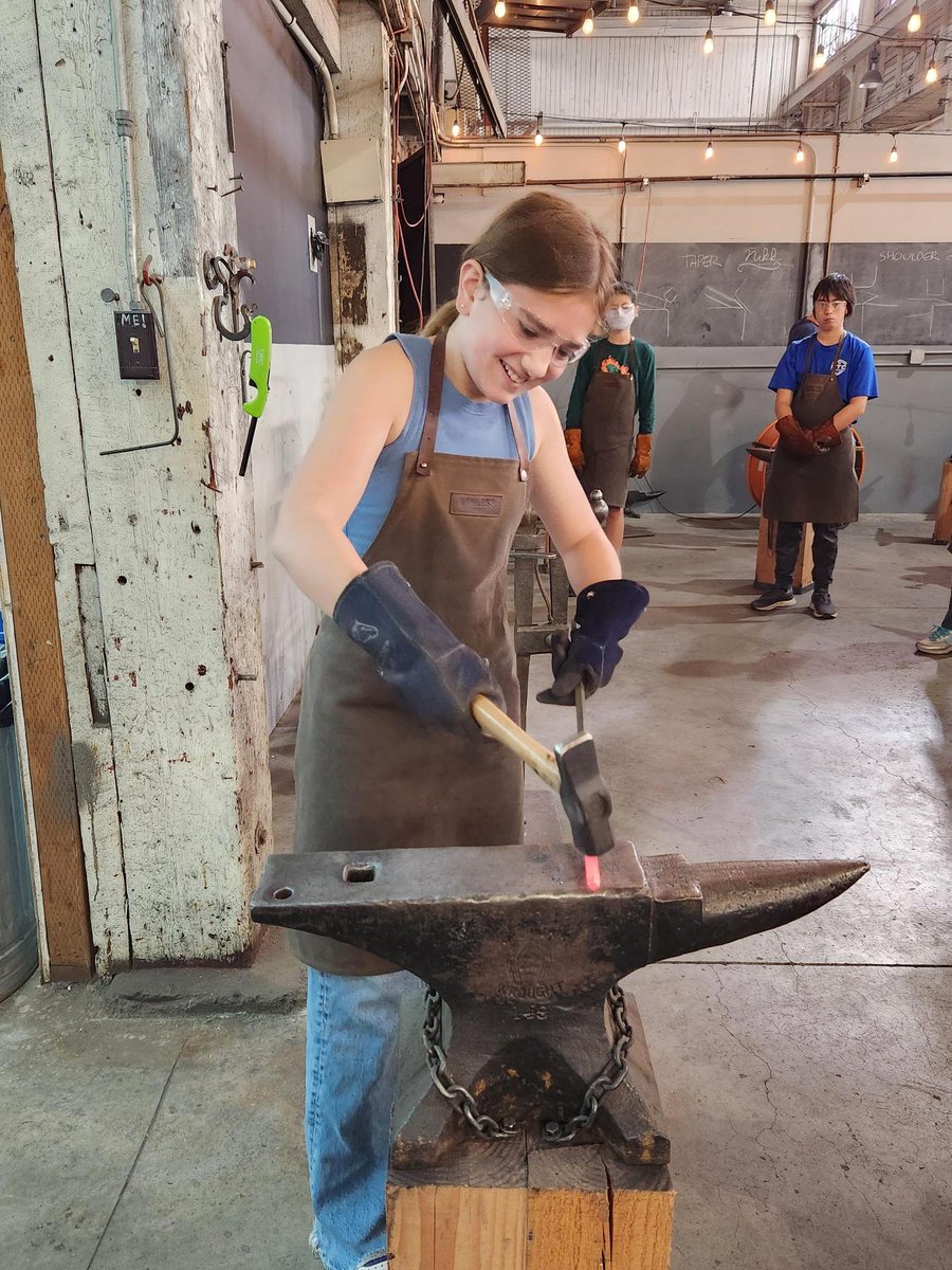 EastsidePrep's tweet photo. Yesterday EPS students in all grades embarked on Fall Orientations, which took them everywhere from scavenger hunts around campus to river rafting and ropes courses. Here's a group of eighth grade students learning blacksmithing at Lawless Forge in Seattle. #EastsidePrep https://t.co/k03zC8gLMv