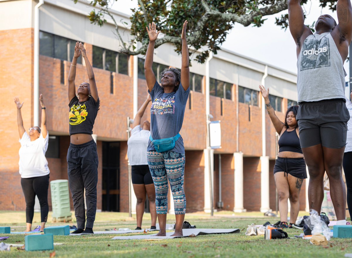 StillmanCollege's tweet photo. A good morning stretch on the yard: students, faculty, &amp; staff started the day with an hour-long #yoga session to begin “Health &amp; Fitness on the 1st,” the first of four events on campus today to celebrate the launch of our Campus #Wellness Program. #DeeplyRootedFutureDriven https://t.co/I1yFxELsxS