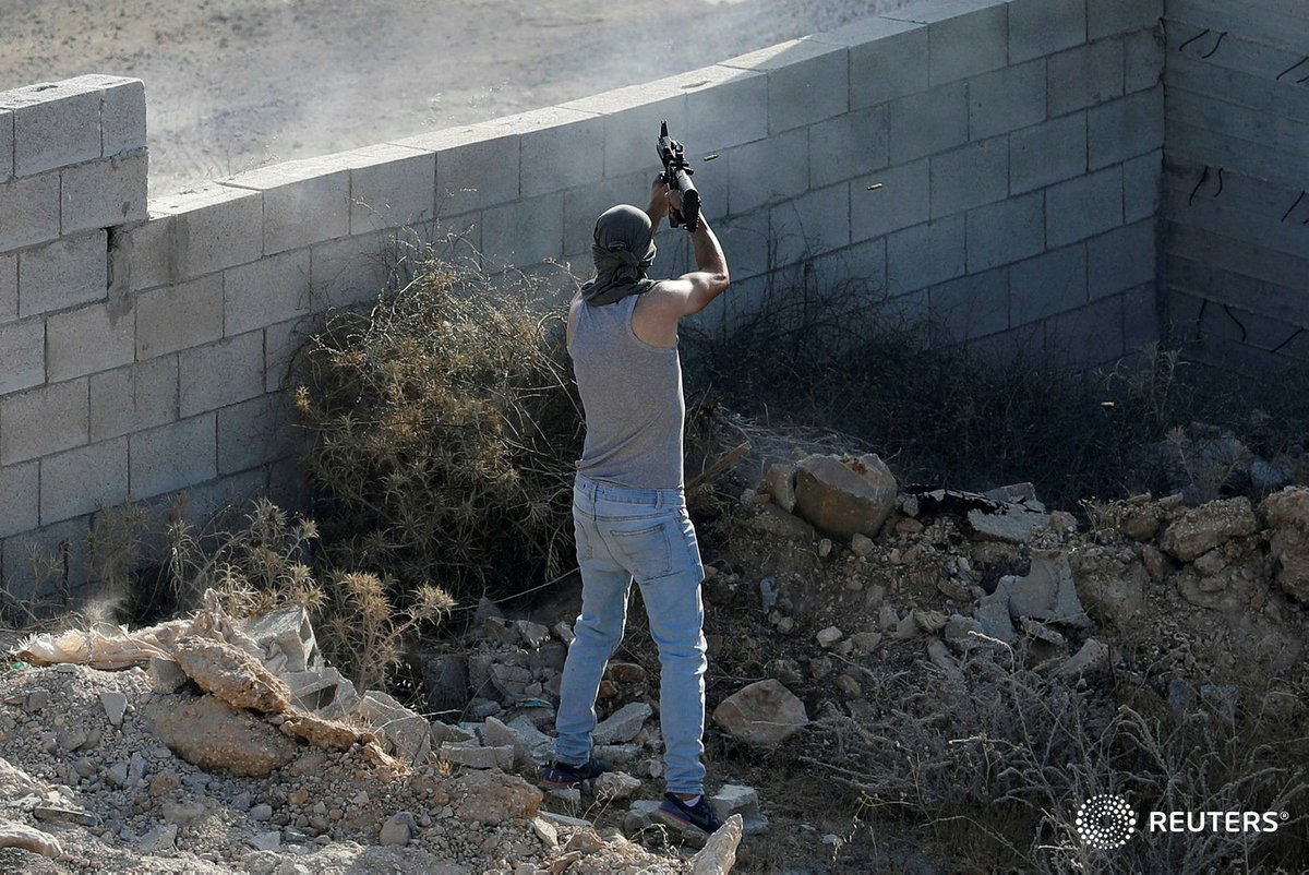raneensawafta's tweet photo. A Palestinian militant shoots at Israeli forces as they take up position near a house where a Palestinian militant is hiding during a raid near #Tubas in the Israeli-occupied West Bank, September 1, 2023. REUTERS/Raneen Sawafta #طوباس #عقابا #كتيبة_طوباس #أحمد_أبوعرة https://t.co/Yl5dPAAlzg