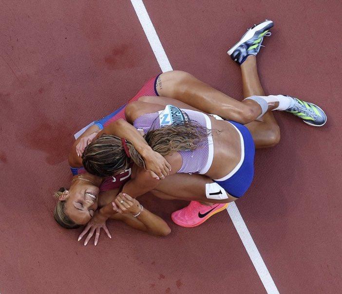 TimC1972's tweet image. This is a picture of Anna Hall. She is embracing and smiling at KJT, who has just beaten her to a gold medal by a tiny margin at the world athletics championships. What a credit this woman is to her competitive nation. I suspect her day will come, more than once.
