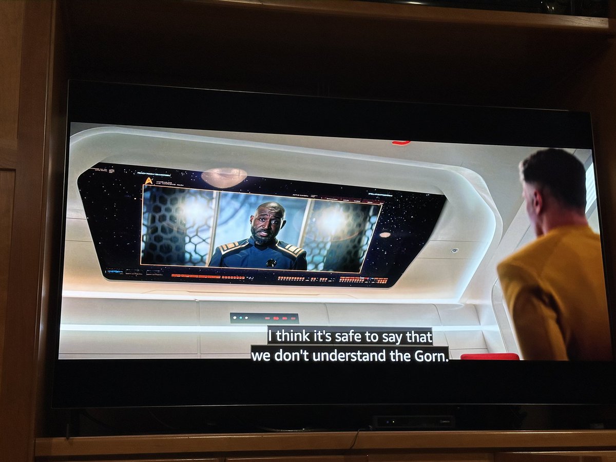 shanselman's tweet photo. I love EVERYTHING about #StarTrekStrangeNewWorlds - it’s near perfect - but I CANNOT get over the angle of this monitor. Folks still mounting TVs too high at an angle over the fireplace in the 24th century?!? #nit https://t.co/d6XK5oGILn