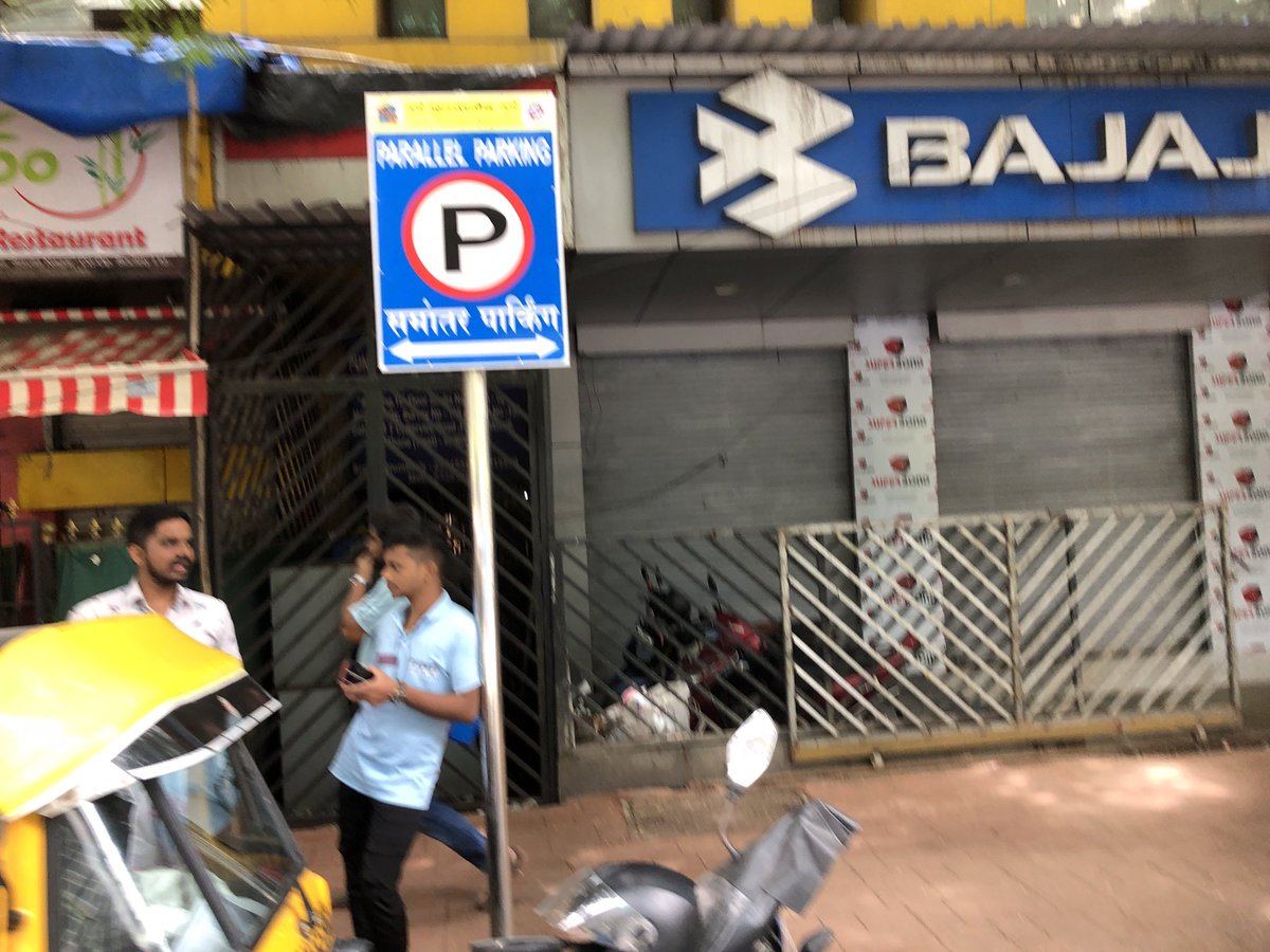 QueenofThane's tweet photo. Dear @ThaneCityPolice Echallan No: TNCCM23008293066  
Twitter user siddhesh's Bike was picked up from a parallel parking board near RTO Thane and no-parking fine applied.  There was No proof in the image provided of no-parking sign. Isnt this towing going towards being a scam ? https://t.co/VykAsrrB9n
