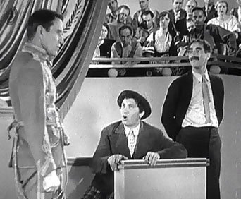 #Chico: Now I ask a you one. What has a trunk, but no key, weighs 2,000 pounds and lives in a circus? #Prosecutor: That's irrelevant. #Chico: Irrelephant? Hey, thatsa the answer. There's a whole lot of irrelephants in the circus #DuckSoup 1933
