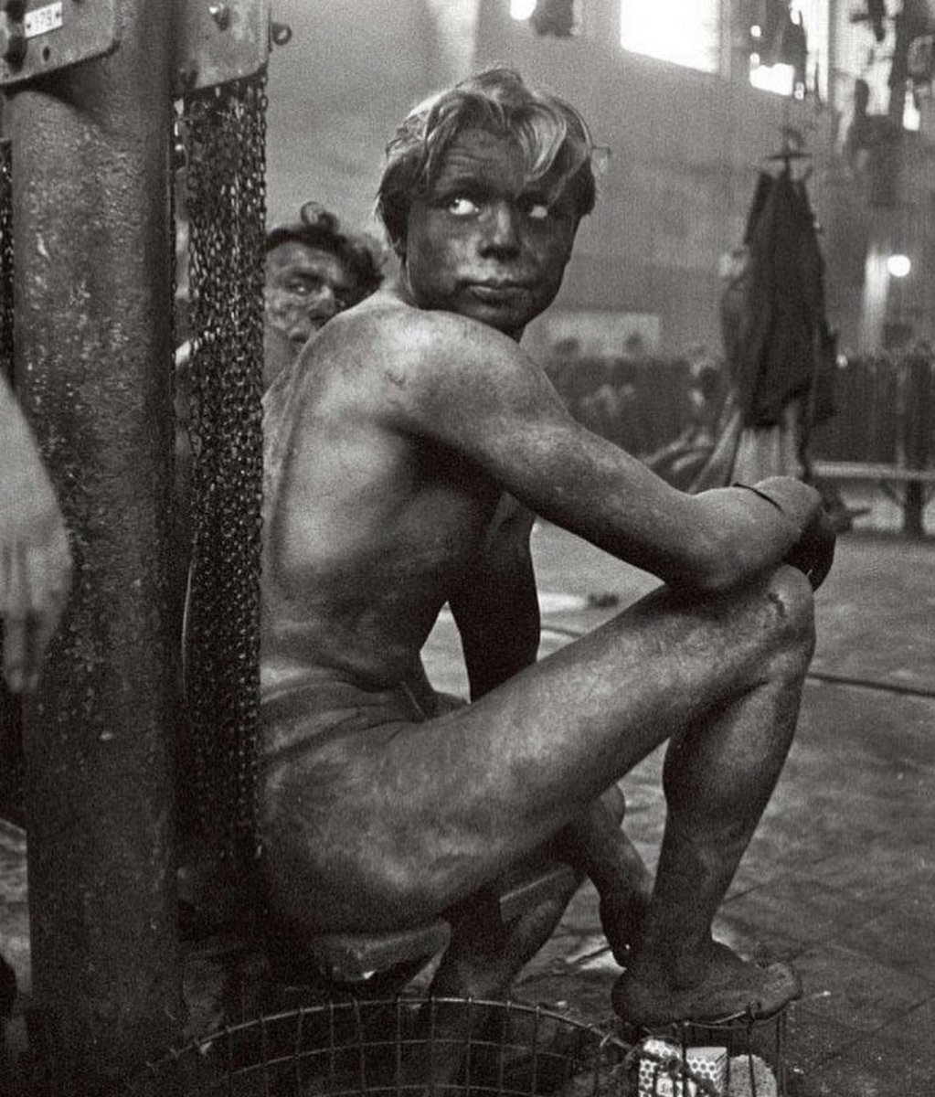 Coal miner waiting to get in the communal shower at the end of a shift in Gelsenkirchen, Germany in 1958.