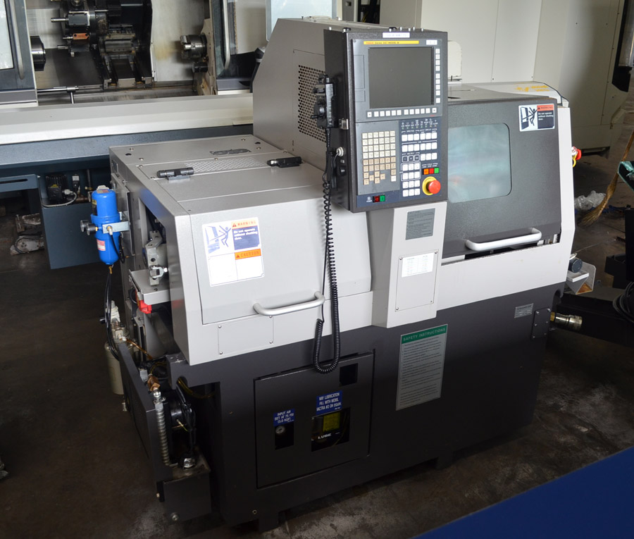 Tsugami B0206-III 6-Axis CNC Swiss-Type Lathe with up to 20mm (.79') capacity.  This multi-axis CNC Machine for sale has a barfeed and chip  conveyor as well as a back working spindle.  Ready for immediate sale.