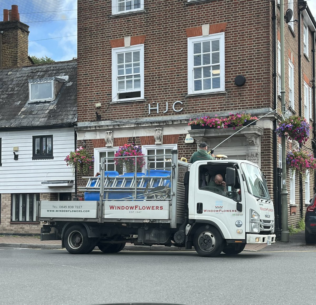 Great to see <a href="/WindowflowersUK/">Windowflowers</a> watering the hanging baskets in <a href="/TDHighStreet/">Thames Ditton High Street Retailers' Association</a> This year’s display is magnificent! Thanks team for such a fab job &amp; <a href="/ElmbridgeBC/">Elmbridge BC</a> for supporting this. It is very much appreciated by residents &amp; businesses <a href="/triciawbland/">Tricia Welch Bland</a>