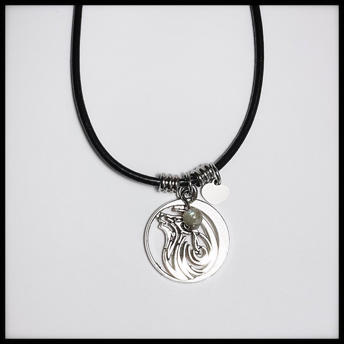 TKeepsakesNS's tweet photo. Wind Swept Wolf Necklace 🐺 

Black leather necklace with stainless steel beads, heart charm, metal wolf pendant and Labradorite gemstone.

Size: 16” to 24” available
Price: $25.00 each plus shipping 
#necklace #leather #wolf #labradorite #heart https://t.co/iSz2YOYICO