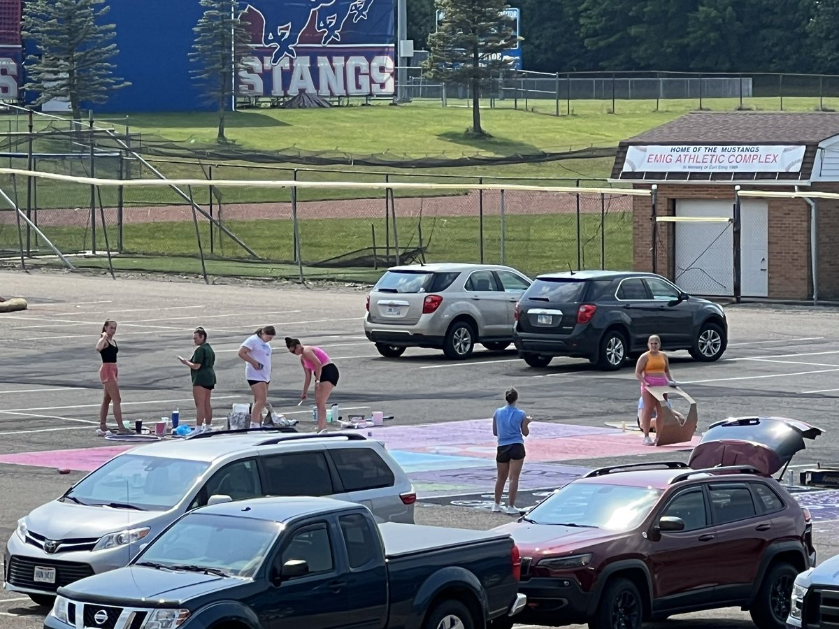 TuslawMLC's tweet photo. The Class of 2024 is hard at work painting their parking spots. I can’t wait to see all my Mustangs on Wednesday! #seniors #classof2024 https://t.co/VmUVwo8XPw
