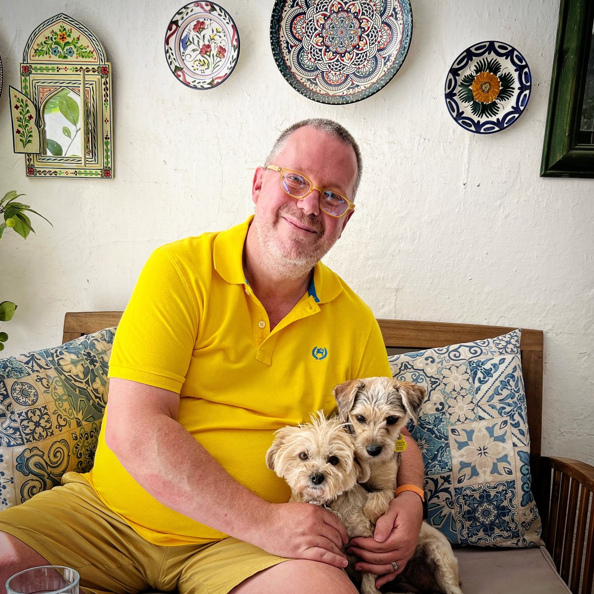 Me and our girls, Coca and Rosquilla, cooling off in the shady courtyard. 

Such lovely dogs - so sweet and loving.