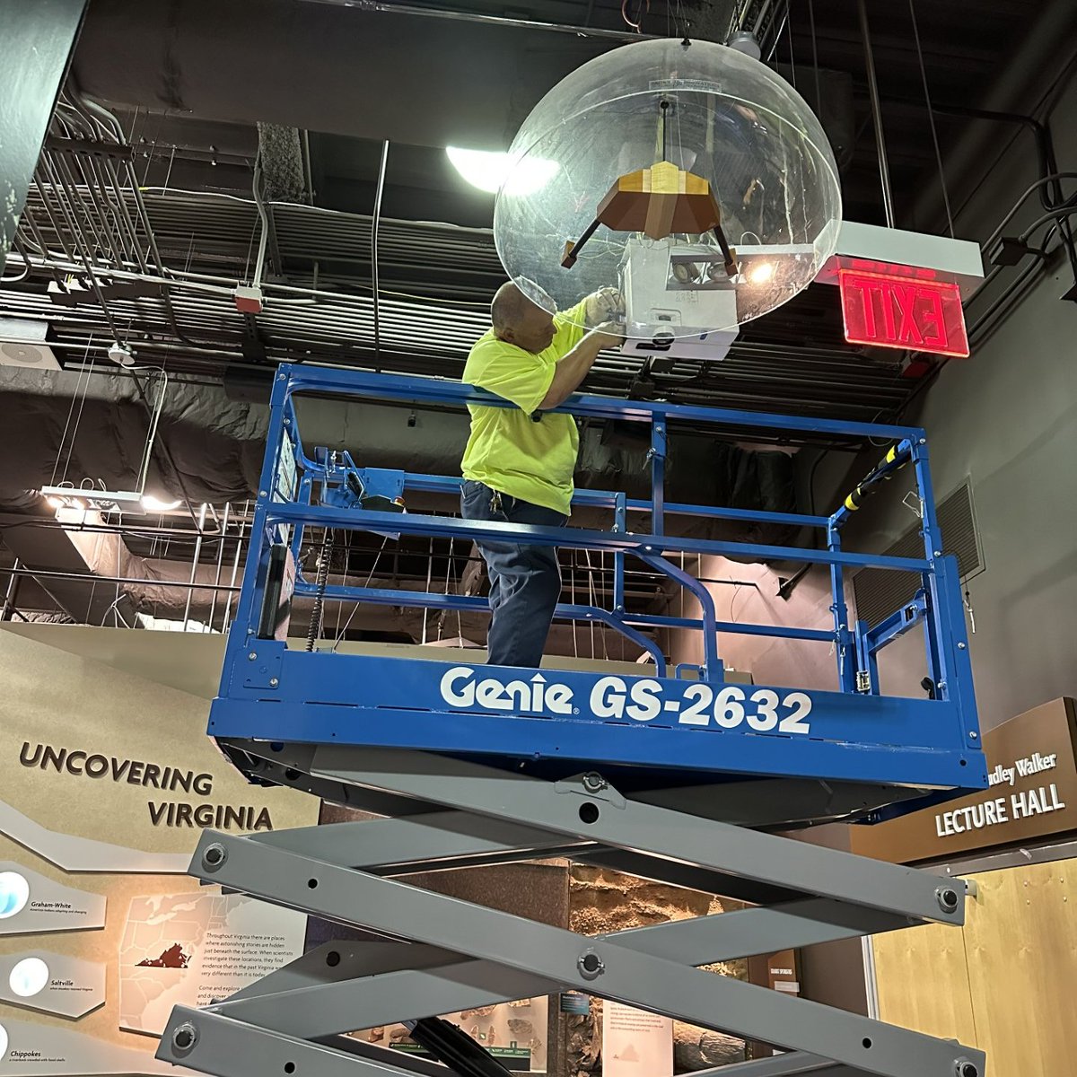Being closed to visitors on Mondays gives the museum's Buildings & Grounds team the opportunity to make repairs inside the exhibit galleries! Today, technician Joel Clifton is hard at work on an overhead projector that's an integral part of the 'Wild Watersheds' exhibit.