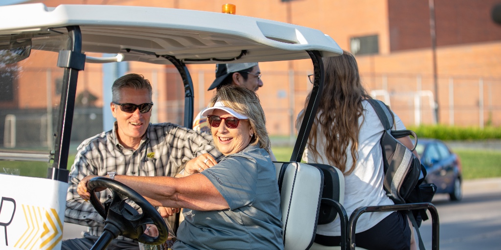 PresidentWSU's tweet photo. Had a great morning with @DrTeriHall, driving Shockers around campus in our #Wuber! 🚕🌾 Few things compare to the energy and excitement on the first day of classes! https://t.co/aVAPIFwWOm