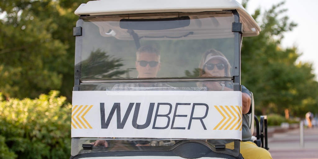 PresidentWSU's tweet photo. Had a great morning with @DrTeriHall, driving Shockers around campus in our #Wuber! 🚕🌾 Few things compare to the energy and excitement on the first day of classes! https://t.co/aVAPIFwWOm
