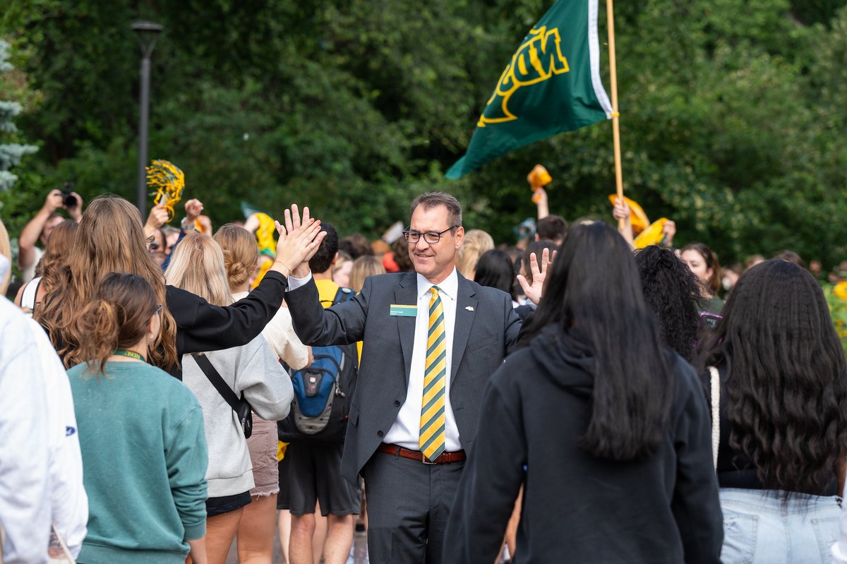 NDSUPresident's tweet photo. A special day at @NDSU: we welcomed the class of 2027 to campus today with cheers and applause as they walked through the gates, eager to start the semester. I know I'm excited for the rest of Welcome Week and the year ahead. Go Bison! 🤘 https://t.co/54fJGKkau4